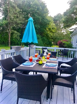 East Falmouth Cape Cod vacation rental - Enjoy outdoor dining and grilling on the deck.
