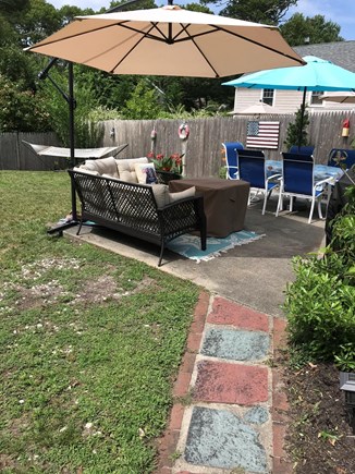 West Dennis Cape Cod vacation rental - Relaxing patio with gas grill and fire pit.