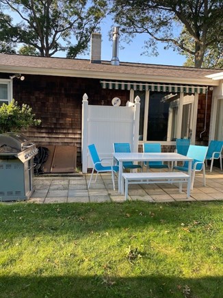 Falmouth Cape Cod vacation rental - Patio with outdoor shower and gas grill.  Table seats up to 7.