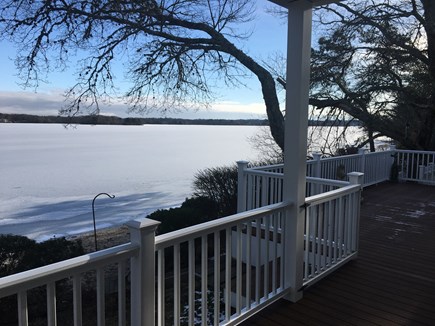 Centerville -Lake Wequaquet Cape Cod vacation rental - ENJOY! Sit and relax on wrap around deck steps to sandy beach.