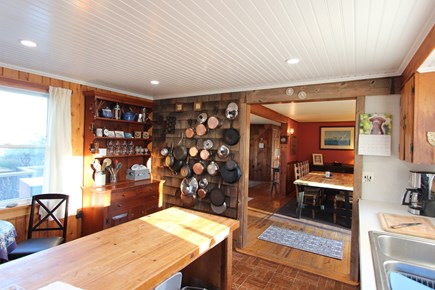 Eastham Cape Cod vacation rental - Full size dining table and sliding doors to deck with gas grill.
