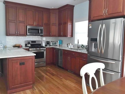 Harwichport Cape Cod vacation rental - Well stocked kitchen with island to seat 4.  Dishwasher!