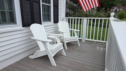 Wellfleet Cape Cod vacation rental - Adirondack chairs on the porch deck facing Commercial Street.