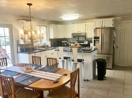 Brewster Cape Cod vacation rental - Open kitchen with table that seats up to 8