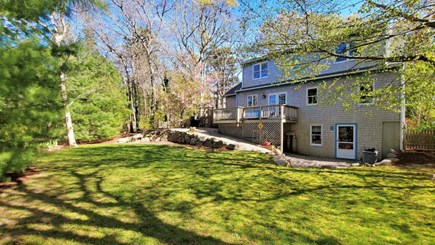 Brewster Cape Cod vacation rental - Fenced in backyard great for kids. Fire pit not shown.