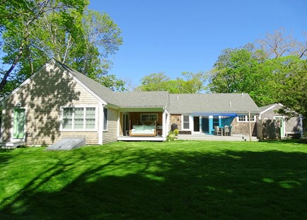 Brewster Cape Cod vacation rental - Back of house showing deck, swing and outdoor shower <br/>