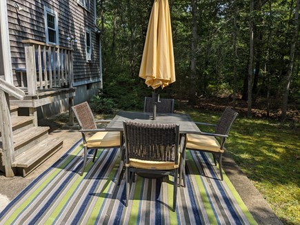 Dennis Cape Cod vacation rental - Propane grill and dining table with umbrella