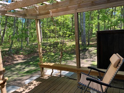 Eastham Cape Cod vacation rental - Relax. Outdoor shower on right, woods beyond. Hammock too.