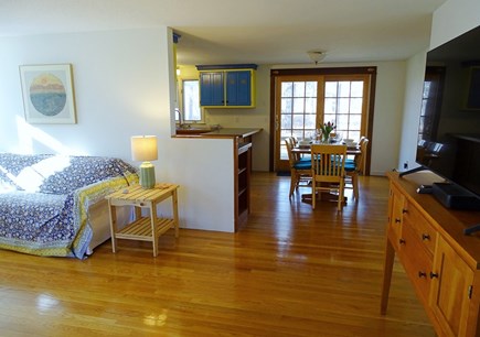 Eastham Cape Cod vacation rental - 1st fl. main house: TV, view to dining area, sliders to deck