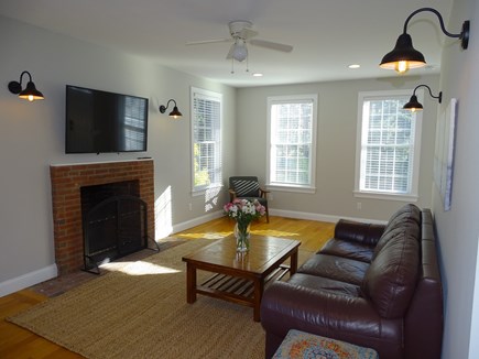 Eastham Cape Cod vacation rental - Living room adjacent to powder room and door to deck