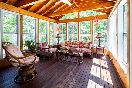 Eastham Cape Cod vacation rental - Screened-in sunroom overlooks deck and backyard