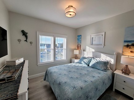 West Yarmouth Cape Cod vacation rental - Master bedroom, comfortable queen bed, TV and view of Mill Creek