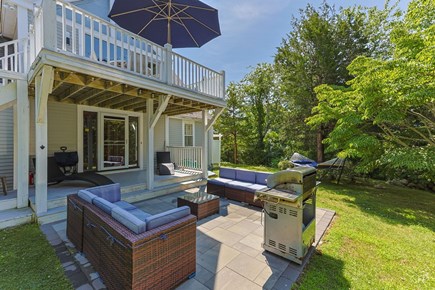 Barnstable Cape Cod vacation rental - Lounge outside with patio set, grill, hammock - fully fenced in!