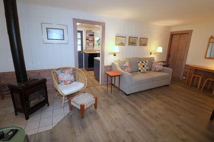 East Dennis Cape Cod vacation rental - Living Room to kitchen with porch beyond