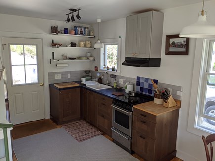 Orleans Cape Cod vacation rental - Kitchen with electric stove and stove vent.