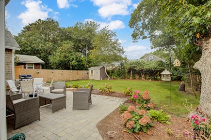 Yarmouth Cape Cod vacation rental - Private backyard/patio area with Weber grill, dining & seating.