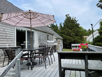 E. Orleans - Tonset Area Cape Cod vacation rental - Large Deck - table seats 6. Built-in bench length of deck