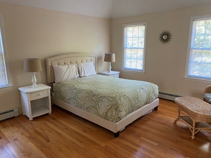 Yarmouth Port Cape Cod vacation rental - Second floor master suite with a queen bed, love seat, and table