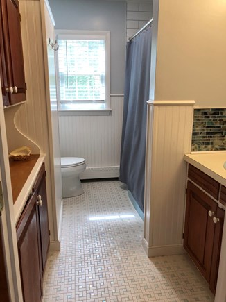 Falmouth, Bay Shore Cape Cod vacation rental - Bathroom on the first floor with 2 cabinets, 1 sink and bathtub