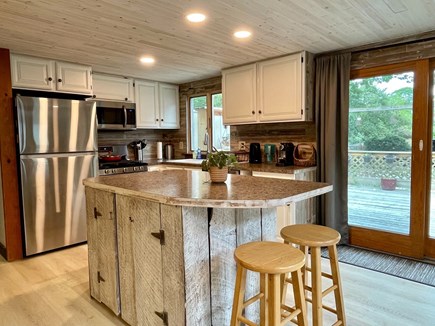 Hyannis Cape Cod vacation rental - Kitchen and sliding door to the backyard