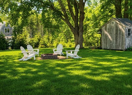 Brewster Cape Cod vacation rental - Backyard with Adirondacks and fire pit