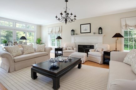 Osterville Cape Cod vacation rental - Front to back living room with fireplace and slider to deck