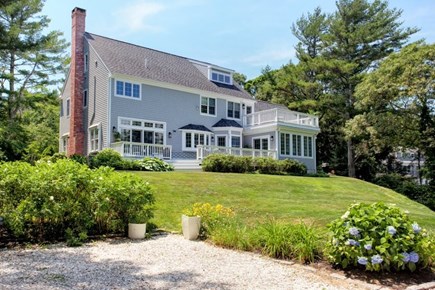 Osterville Cape Cod vacation rental - Back of house with large landscaped yard