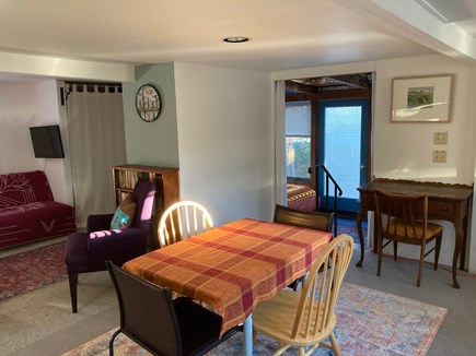 Provincetown, Historic East End, independent Cape Cod vacation rental - Dining table, sunroom in center background