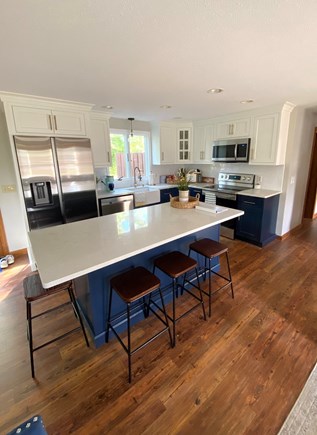 Eastham Cape Cod vacation rental - Large kitchen island with four stools, all new appliances