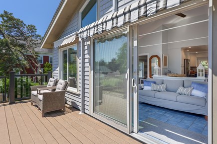 West Dennis Cape Cod vacation rental - Second Floor Deck with seating and stairs down to patio