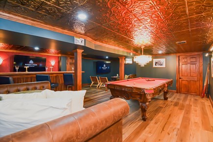 East Dennis Cape Cod vacation rental - Speakeasy basement bar with 8 foot pool table, TV area, and bar.