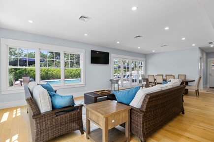 Chatham, Crows Pond and Pleasant Bay Cape Cod vacation rental - Poolside den with dining