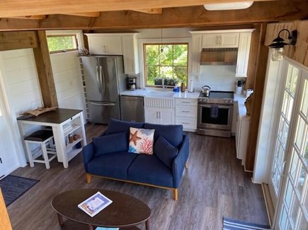 East Sandwich Cape Cod vacation rental - Living area leads through slider to covered outdoor deck