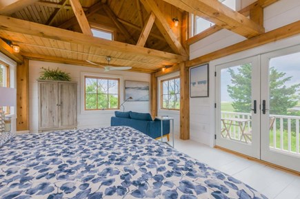 East Sandwich Cape Cod vacation rental - King Bedroom with seating area and doors to balcony