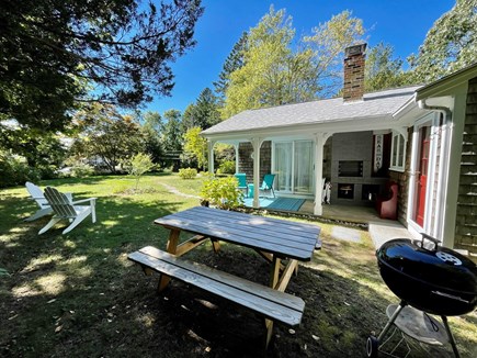 West Barnstable - off Route 6A Cape Cod vacation rental - Private yard with picnic table, grille, Adirondacks & beach toys.