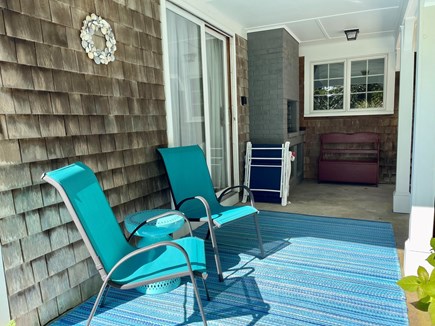 West Barnstable - off Route 6A Cape Cod vacation rental - A covered porch for morning coffee or watching the rain chain.
