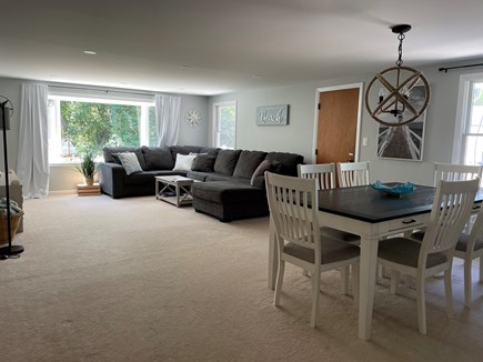 Eastham Cape Cod vacation rental - Living Room/Dining Room area (65' smart TV and super comfy couch!