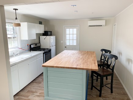Dennis Port Cape Cod vacation rental - Living room looking into kitchen.