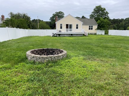 Hyannis, Barnstable Cape Cod vacation rental - Back yard with fire pit and patio