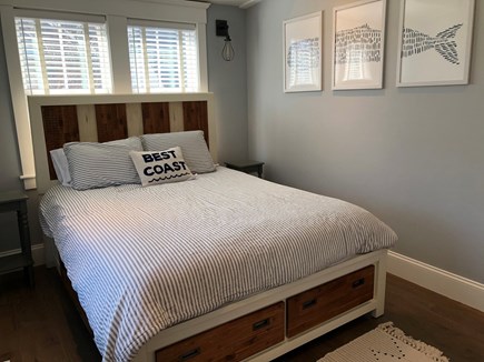 Provincetown Cape Cod vacation rental - Bedroom with queen bed and bed storage.