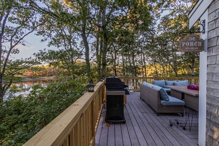 Harwich - Brewster Border / Ch Cape Cod vacation rental - A north-facing deck with panoramic vistas of the woods & the pond