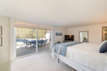 East Dennis Cape Cod vacation rental - Carriage House - First Floor King Bedroom Overlooking Pool
