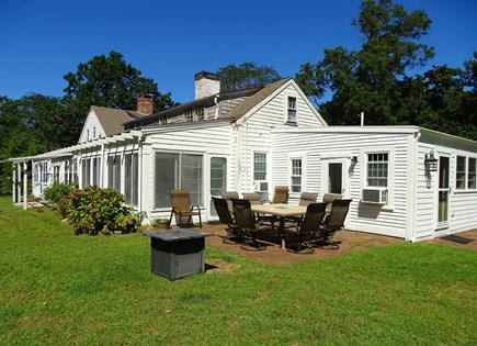 Dennis Cape Cod vacation rental - Back patio with gas grill, large seating area, water views