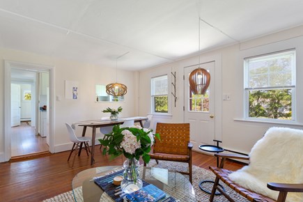 Truro Cape Cod vacation rental - Mid-century themed living and dining area. Large Smart TV