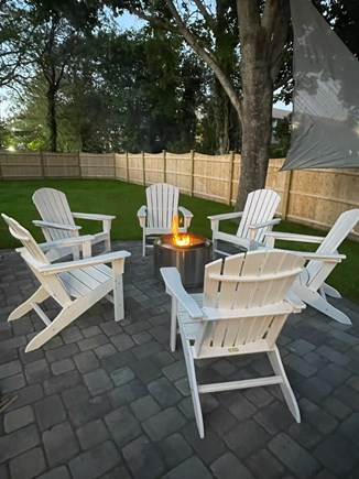 Yarmouth- Colonial Acres Cape Cod vacation rental - Firepit with comfortable seating and large backyard