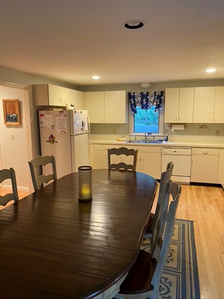 Eastham Cape Cod vacation rental - Dining table and kitchen at Georgia's