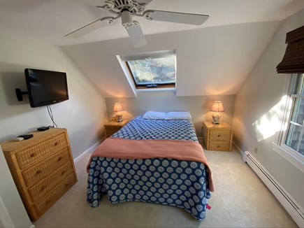 Eastham Cape Cod vacation rental - Queen bedroom has closet, dressers, and TV.