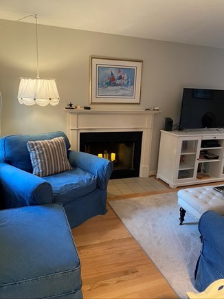 Eastham Cape Cod vacation rental - Person and a half chair by the fireplace.
