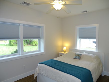 Falmouth Cape Cod vacation rental - Queen bedroom with desk, entrance to bathroom