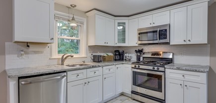 South Yarmouth Cape Cod vacation rental - Kitchen view of the appliances, window views the backyard